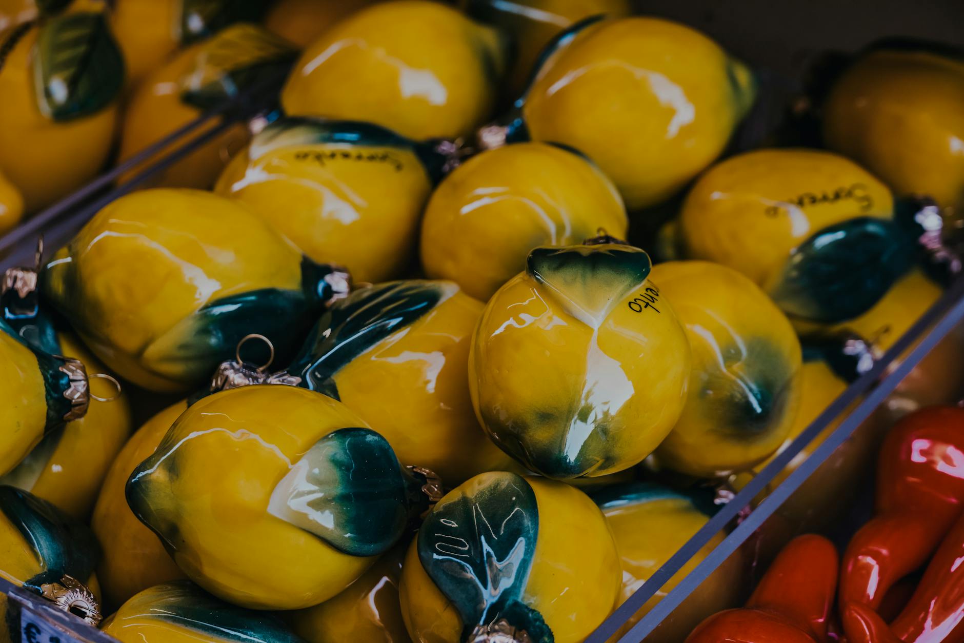Hand holding a bright lemon against a vivid yellow background, symbolizing fresh approaches to desire